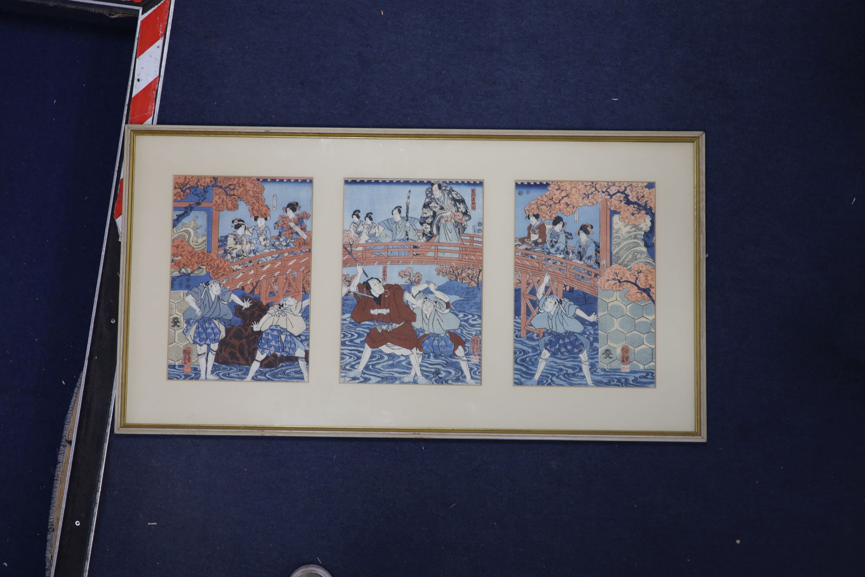 Kuniyoshi (1797-1861), three woodblock prints, Figures on a bridge, each 36 x 24cm, framed as one